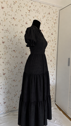 Black maxi dress with textured pattern and tiered skirt