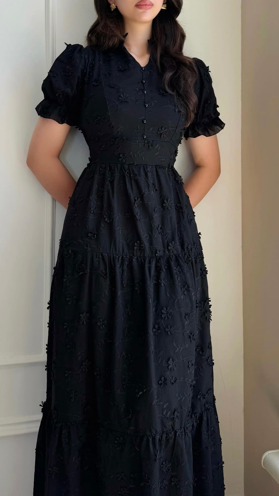 Black maxi dress with textured pattern and tiered skirt