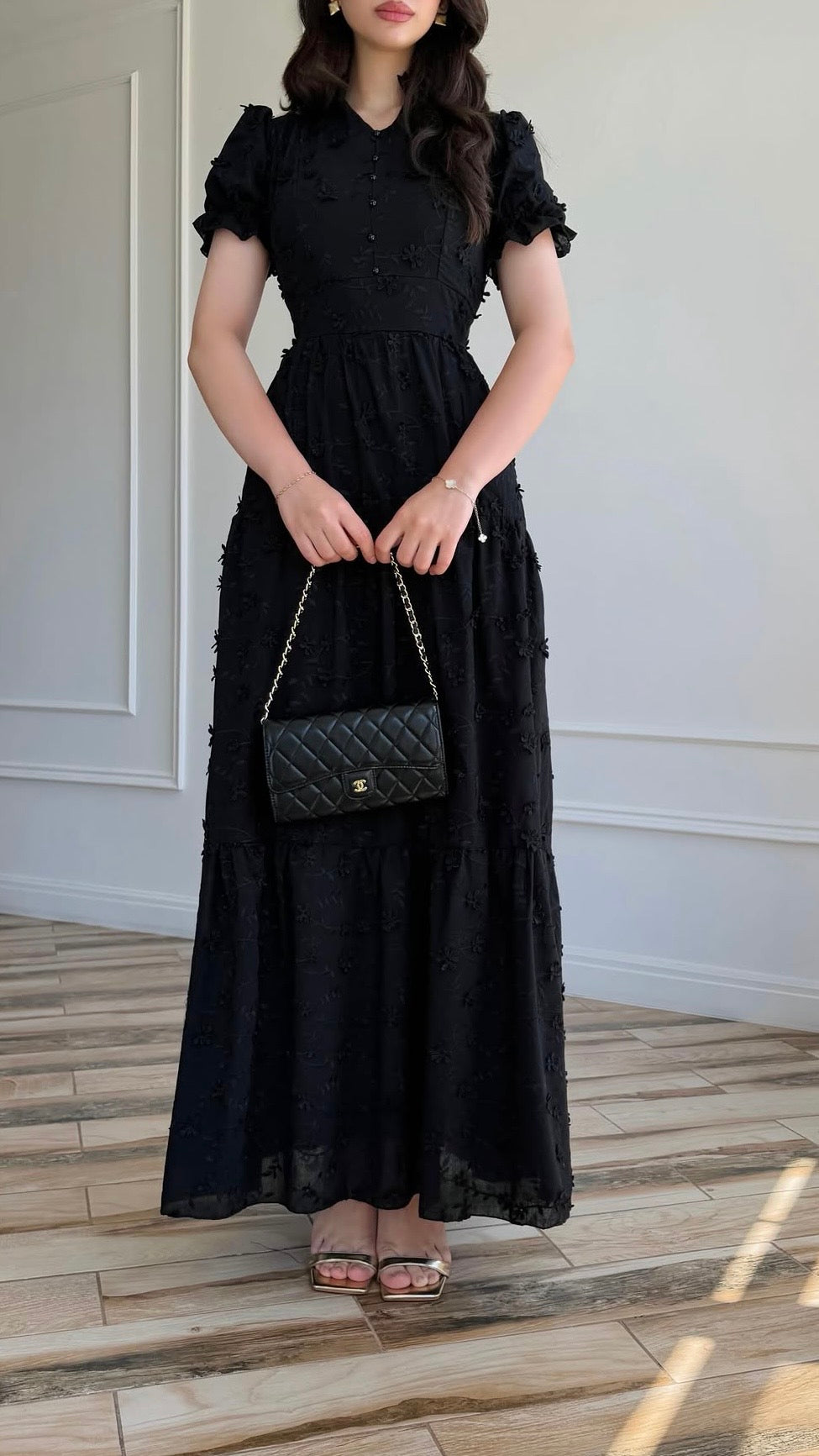 Black maxi dress with textured pattern and tiered skirt