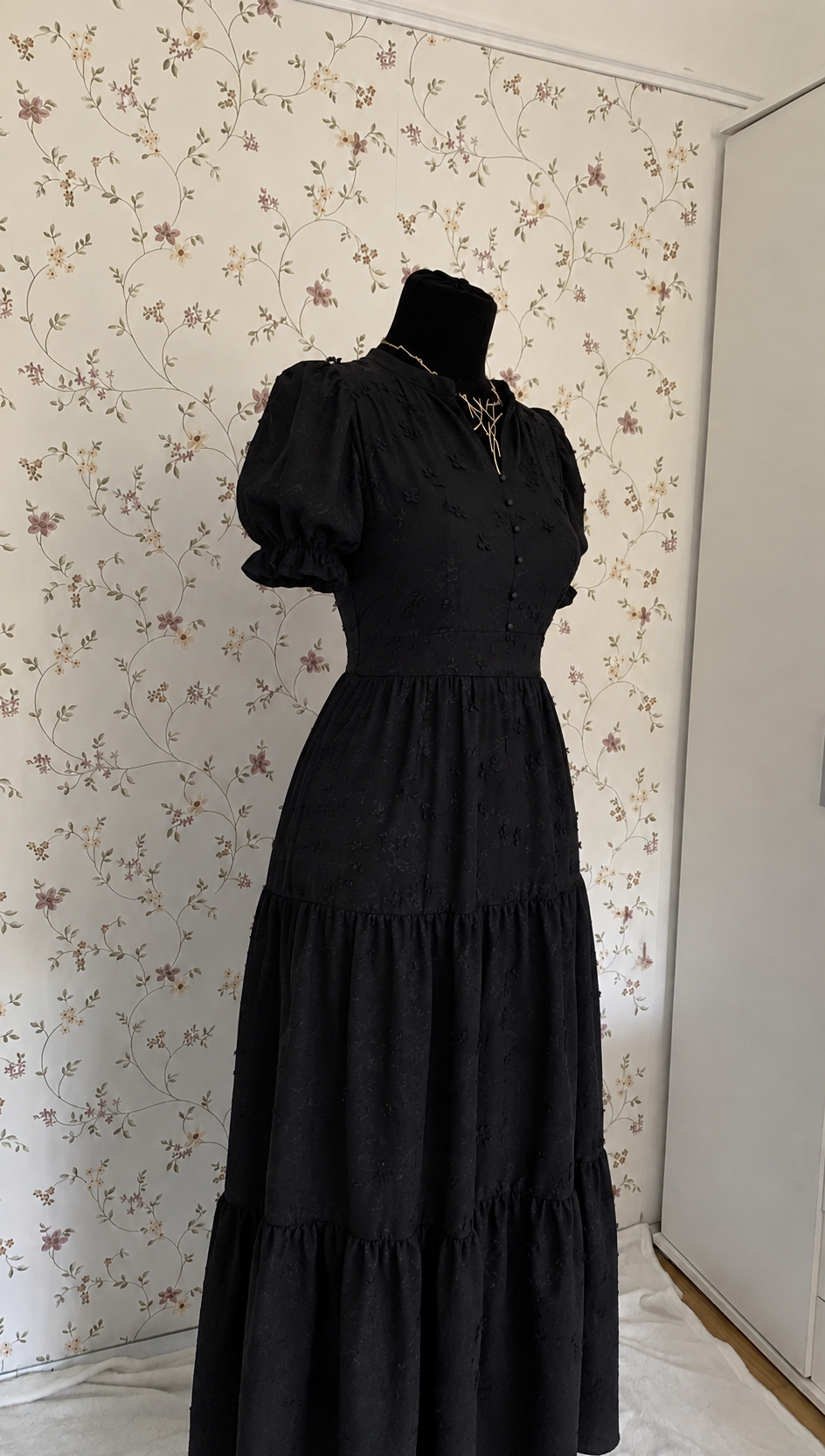 Black maxi dress with textured pattern and tiered skirt